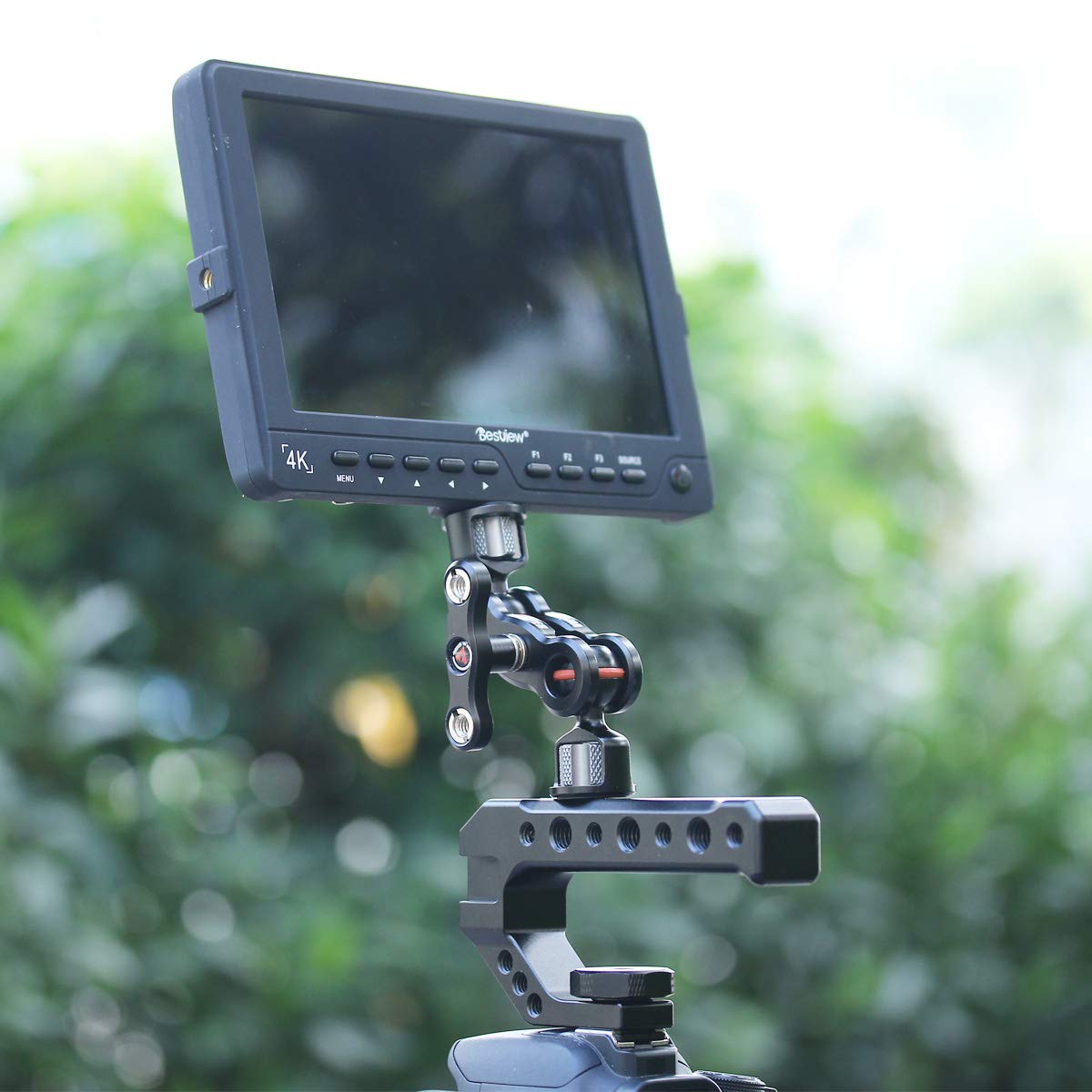 Camera rig handle with monitor and microphone mounting support